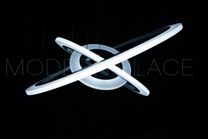 Modern circular LED pendant light fixture against a dark background.