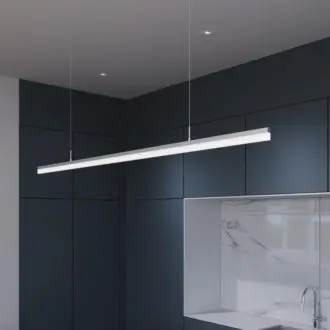 Modern kitchen with sleek LED pendant light over marble countertop.