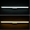 htb1dzlzjxxxxxcvxfxxq6xxfxxxf Wall-mounted LED light bars in cool and warm white on a dark background