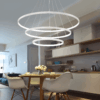 HTB1_xXoADtYBeNjy1Xdq6xXyVXag Modern dining room with circular pendant light and stylish decor.