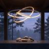 c83482cb-6ec8-4fd9-9c4f-36cb06607959 Modern circular chandelier illuminating a serene outdoor scene with stacked stones at dusk.