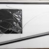 New black computer monitor unpacking with cables and foam padding.