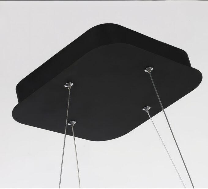 Stylish geometric chandelier light with warm glow in modern minimalist living room