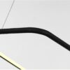 Close-up of black curved metal bar with contrasting white background
