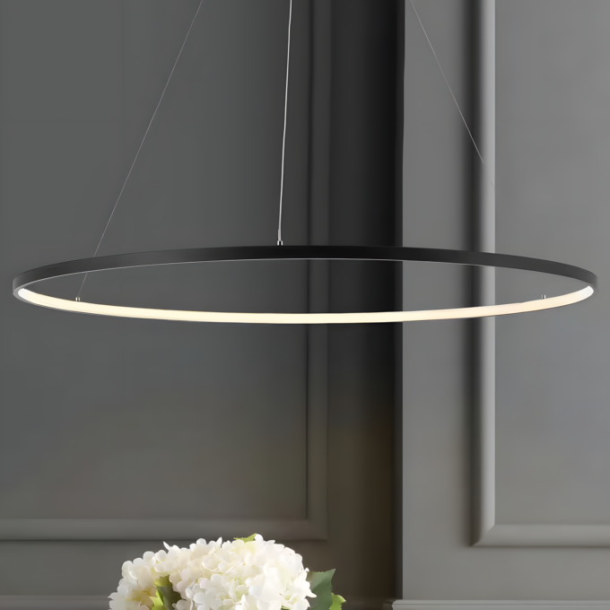 matte-black-jonathan-y-pendant-lights-jyl7220a-64_1000 (Custom) Modern circular LED pendant light fixture in a minimalistic interior with a flower arrangement beneath it.