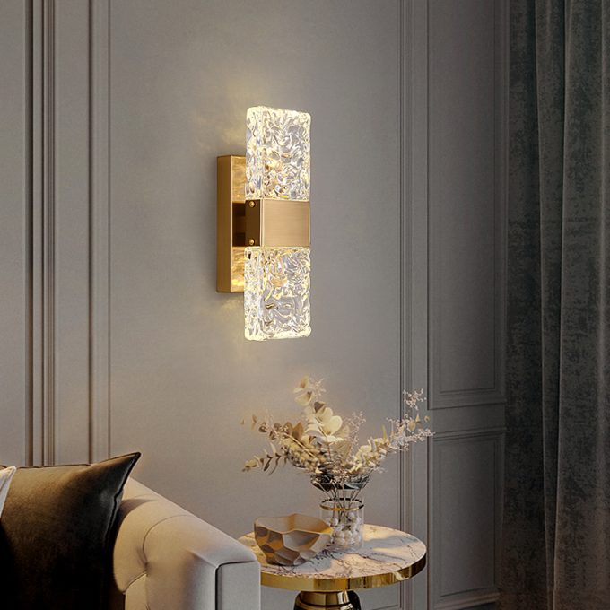 Elegant crystal wall sconce lighting in a modern living room setting.