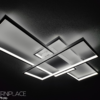 IMG20230306190127 Modern LED geometric ceiling light fixture with overlapping rectangular frames, providing sleek and stylish illumination.