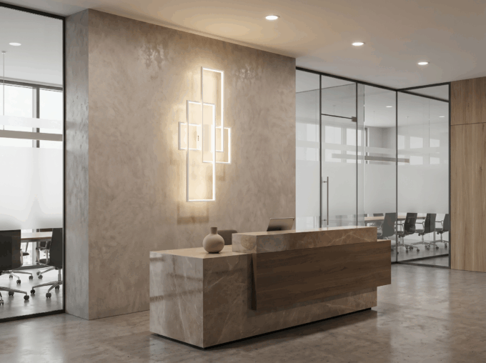 blocks_office_white Modern office reception with marble desk, abstract wall art, and glass meeting room in the background.