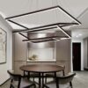 Rectangle-Modern-led-Dinning-Room-Suspension-Luminaire.jpg Modern kitchen with geometric hanging lights, round table, and sleek cabinetry.