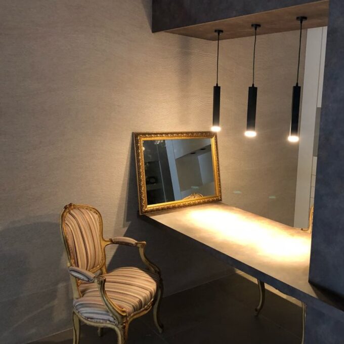 indoor-setting-light-mini-pendant Elegant vintage chair and mirror with modern pendant lights in a stylish interior.