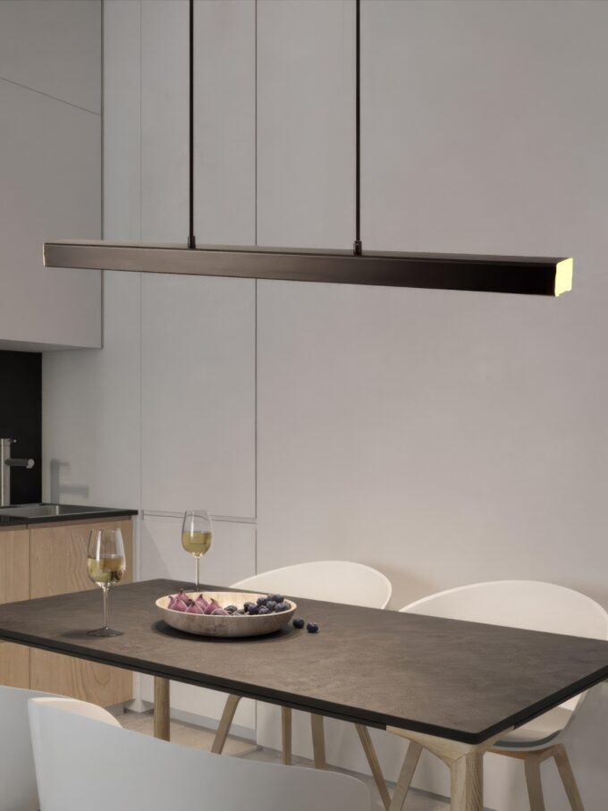 Modern-LED-dining-room-chandelier-lighting-Nordic-restaurant-long-hanging-lights-office-fixtures-Bar-illumination-study.jpg (1) Modern pendant light over minimalist dining table with wine glasses.