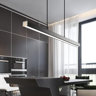 Modern kitchen interior with pendant lighting over island.