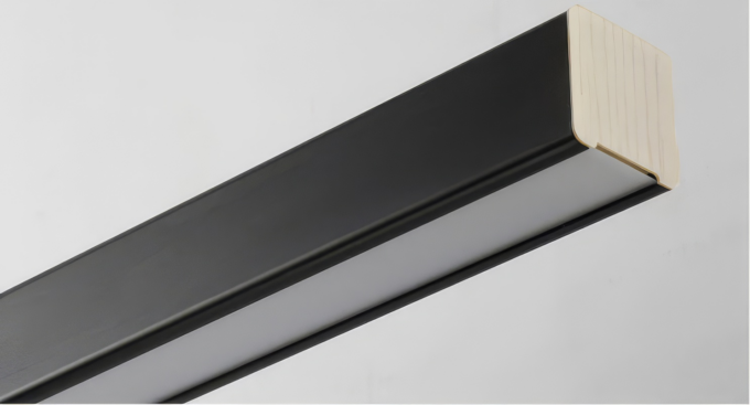 new-style-office-side-view Black picture frame edge with contrasting wood corner detail on a grey background.