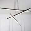 MD19103-3-4-small Modern LED pendant light fixture with a geometric design, hanging in a room with white walls.