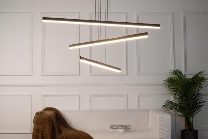 MD19103-3 small Modern glass pendant lights with copper fixtures hanging over a minimalist kitchen island