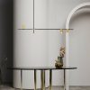 $_10 (1) Modern minimalist interior with elegant pendant lighting and round table.