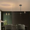 mid-century-astral Modern pendant lights over a stylish dining room table setup.