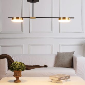 Modern living room with white sofa, pendant lights, and elegant decor.