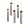 Modern gold and glass pendant lights on a white background.