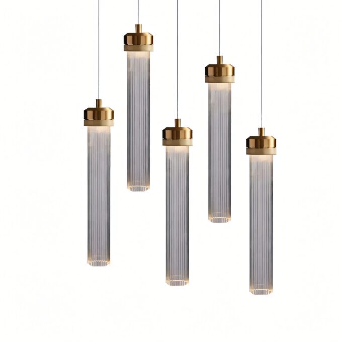 Modern gold and glass pendant lights on a white background.