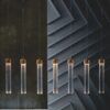 Modern pendant lights with gold accents against dark background