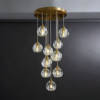 1 Modern gold pendant chandelier with crystal lights, elegant lighting fixture for contemporary home décor.