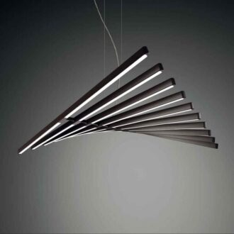 Piano" pendant light fixture with multiple angled metallic bars, emitting soft light, suspended from a gray ceiling.