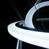 dsc01221-wm Large modern chandelier with LED lights and crystal teardrop details, nestled in a coffered ceiling.