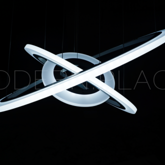 Modern circular LED pendant light fixture against a dark background.