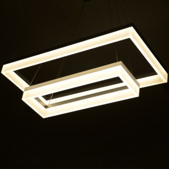 Modern geometric pendant lights with warm LED illumination.