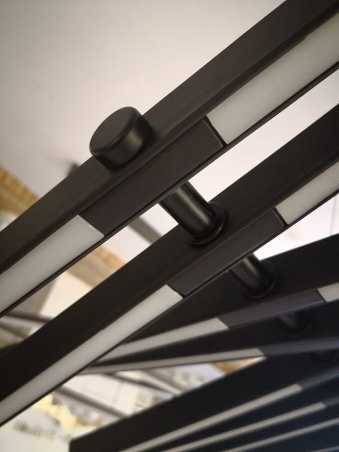 IMG_20171206_112410 Close-up of modern black window blinds with sleek design.