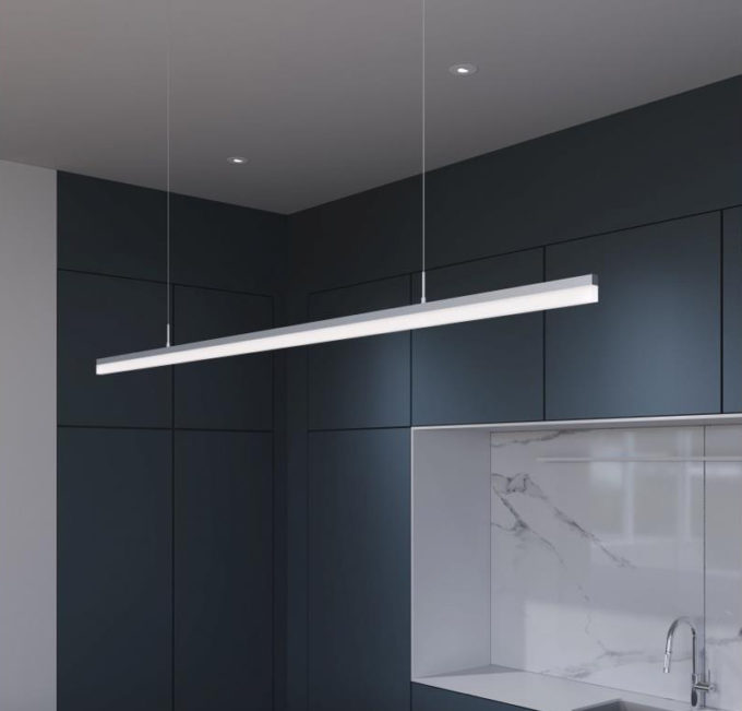 silver-led-pendant-linear-fixture Modern kitchen with sleek LED pendant light over marble countertop.