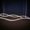 DSC01031 Modern wavy LED pendant light fixture against dark background