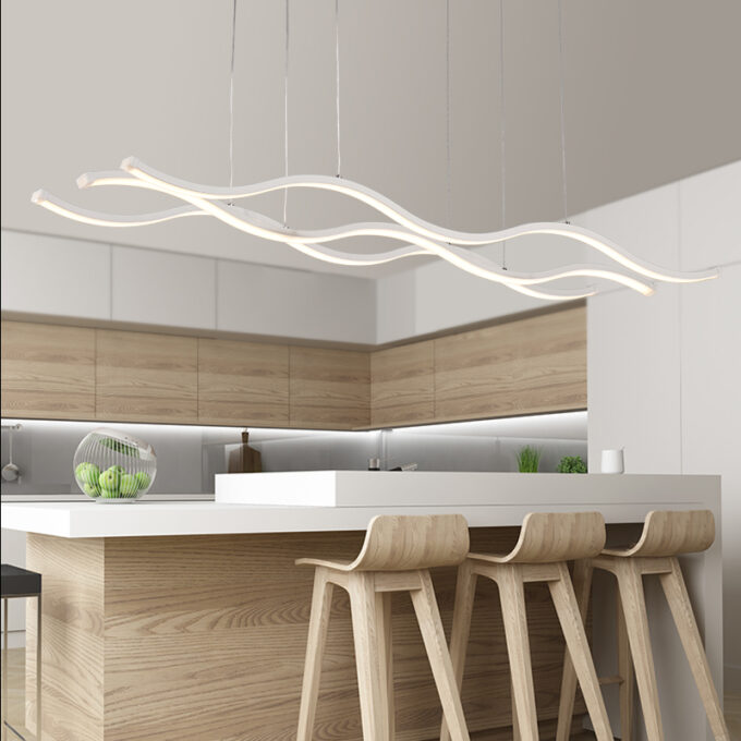 minimal-modern-3-wave-light-fixture Modern kitchen with stylish wave-design pendant lighting over island.