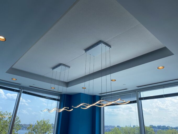 image0 Modern office ceiling with stylish pendant lights and city view through windows.
