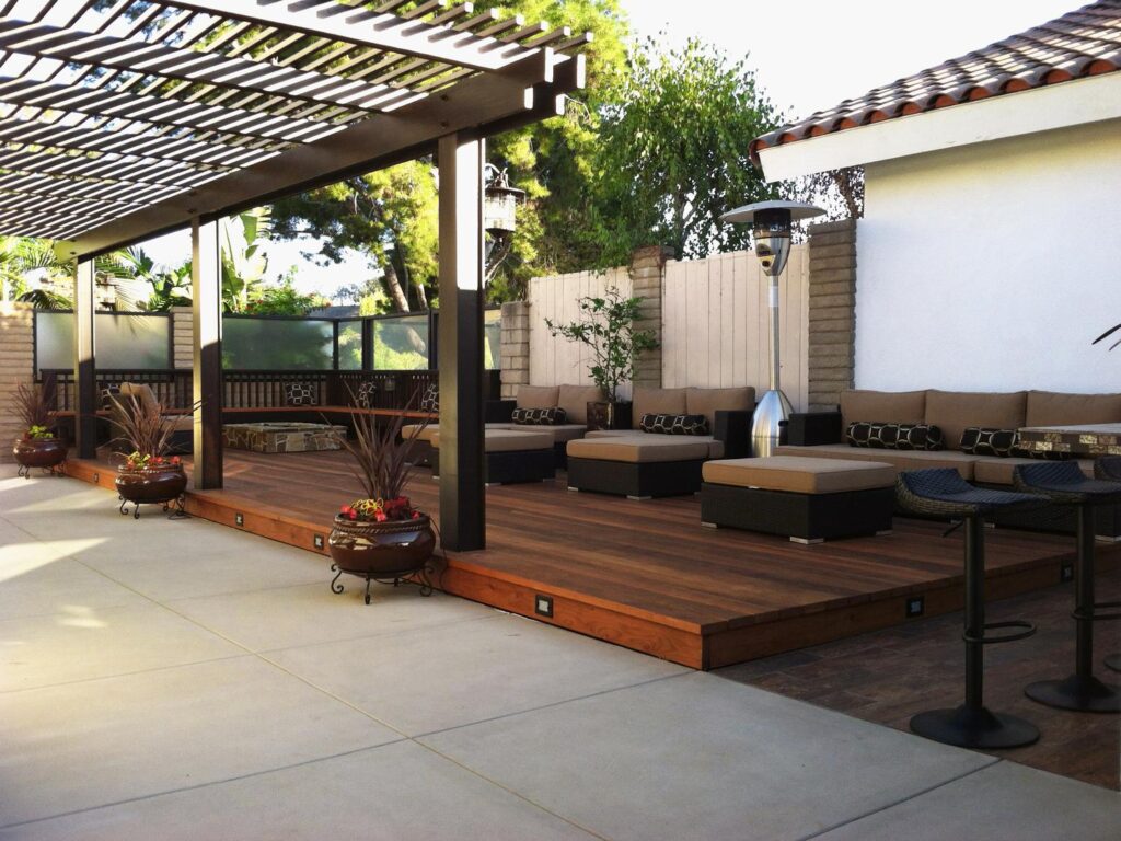 outdoor-living-area-with-modern-sofa-style-and-above-tiled-garden-deck-and-with-mini-bar-and-bbq-claudia-schmutzler-contemporary-backyard-wooden-decks