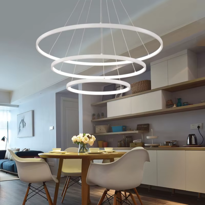Modern dining room with circular pendant light and stylish decor.