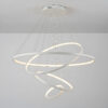 Modern LED pendant light with circular designs hanging from ceiling