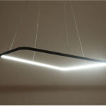 Modern LED pendant light fixture with a sleek design hanging from a ceiling.