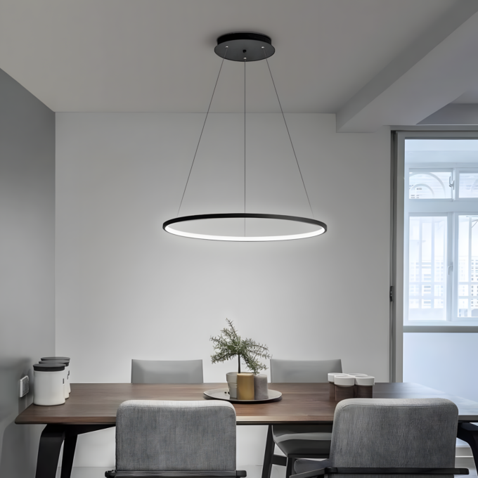61ancfkvwcL._AC_SL1200_ (Custom) Modern dining area with minimalist decor, featuring a circular pendant light above a wooden table with a small plant centerpiece.