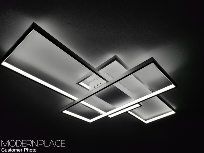 IMG20230306190127 Modern LED geometric ceiling light fixture with overlapping rectangular frames, providing sleek and stylish illumination.