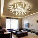 Modern living room with stylish geometric ceiling light fixture.
