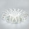 Modern white LED ceiling light with abstract loop design on a grey background.