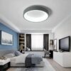 luxury-Round-Square-Modern-Le Modern bedroom interior with blue accent wall and LED ceiling light.