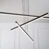 MD19103-3-4-small Modern LED pendant light fixture with a geometric design, hanging in a room with white walls.