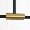 MC1541R-2 (1) Close-up of a gold-colored metal tube connector joining black rods.