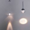 51bx2wwZxAL._AC_SL1500_ Modern pendant lights with warm glow on a gray background.