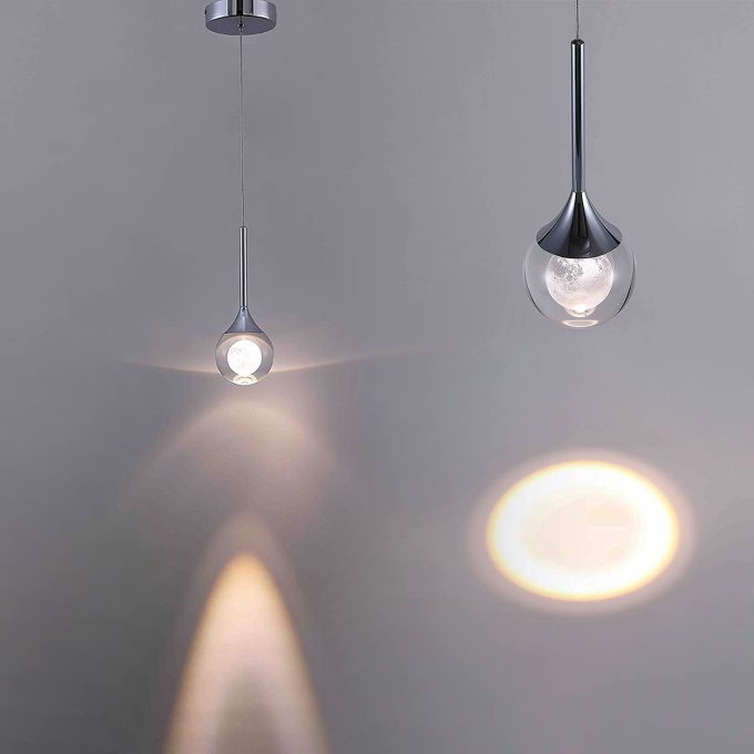 51bx2wwZxAL._AC_SL1500_ Modern pendant lights with warm glow on a gray background.