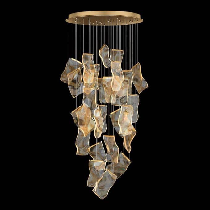 1 Modern gold pendant light with abstract shapes on black background.