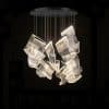 3 Modern mesh design chandelier lighting fixture in a dark room.